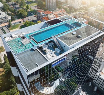 A rooftop pool overlooking the cityscape, offering a serene oasis amidst the urban hustle and bustle.